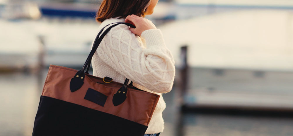 Heritage Tanbark Market Tote hand-carried on dock