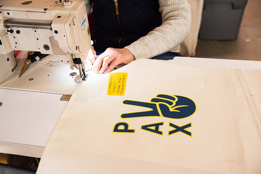 Stitching of a sail from the sail boat BAHATI into a Sea Bags Tote