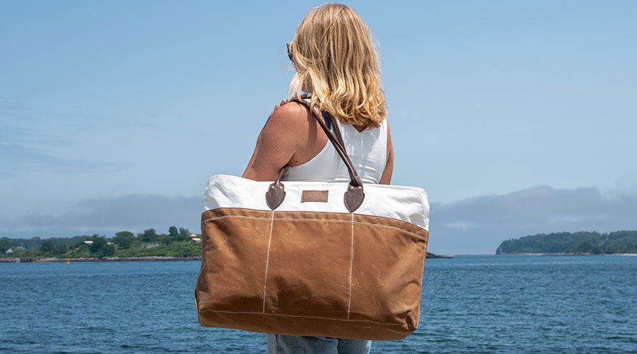 Tan Chebeague Tote worn by model at the seaside