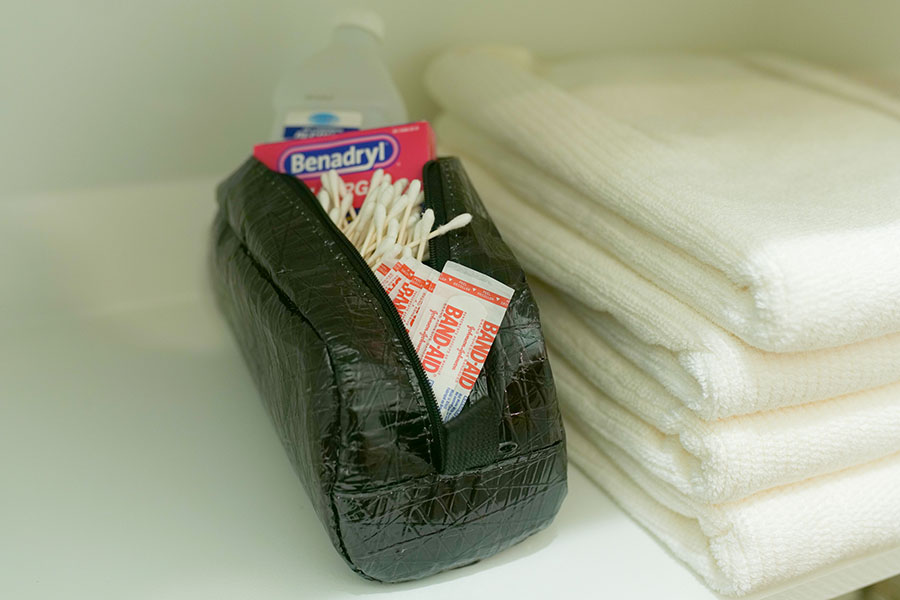 Recycled Sail Toiletry Bags in the medicine cabinet