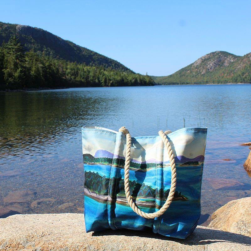 Eric Hopkin's Watercolor Tote depicts the coastline of Maine on recycled sail