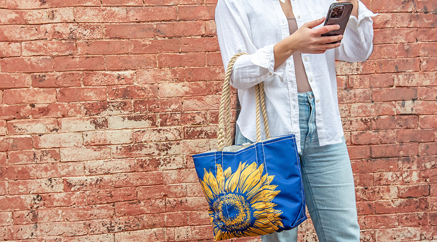 Woman holding Sunflower Handbag