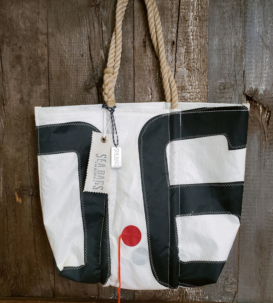 A Vintage Insignia tote featuring a telltale on the front of the bag