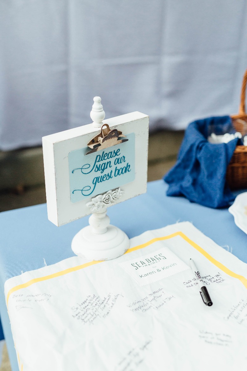 A unique idea for a guest book, Sea Bags' recycled sail cloth panel is displayed at the event for guests to sign