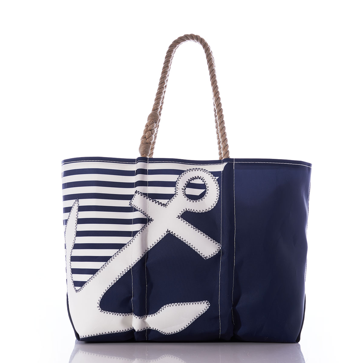  the breton stripe white anchor totes are embellished with a white anchor in front of a solid navy bottom corner and a navy and white striped top corner and hemp rope handles