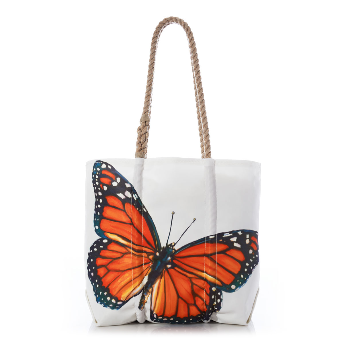 a white sail cloth medium tote with hemp rope handles is printed with a detailed orange and navy blue monarch butterfly