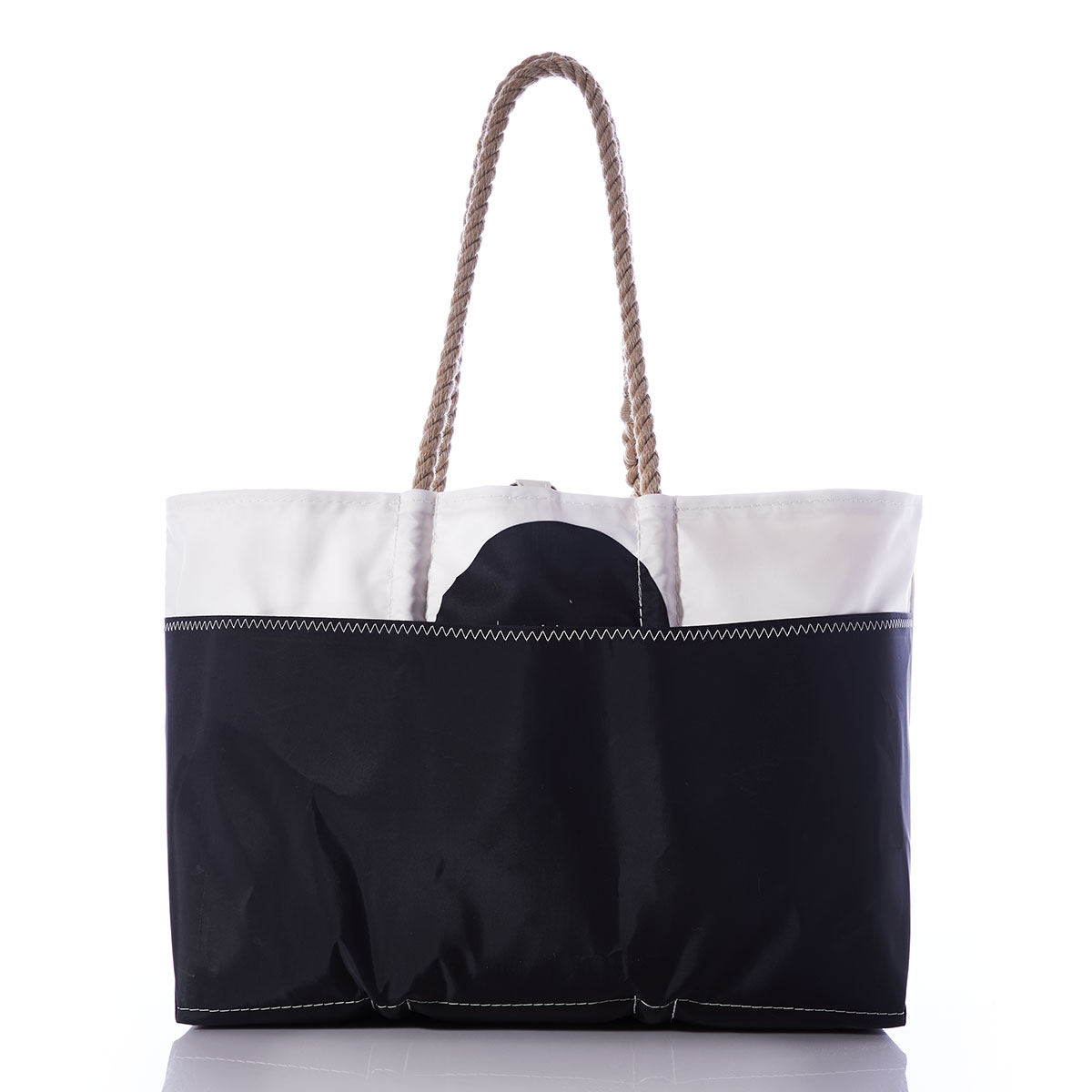 back view: black legs of an octopus reach up to the top of this recycled sail cloth tote, with a solid black along the bottom, and hemp rope handles