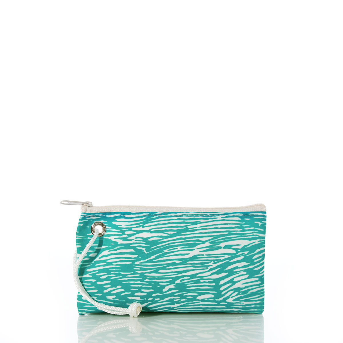 back view of a curved blue dolphin sits on aquamarine waves printed on a recycled sail cloth wristlet with a navy zipper and wristlet strap
