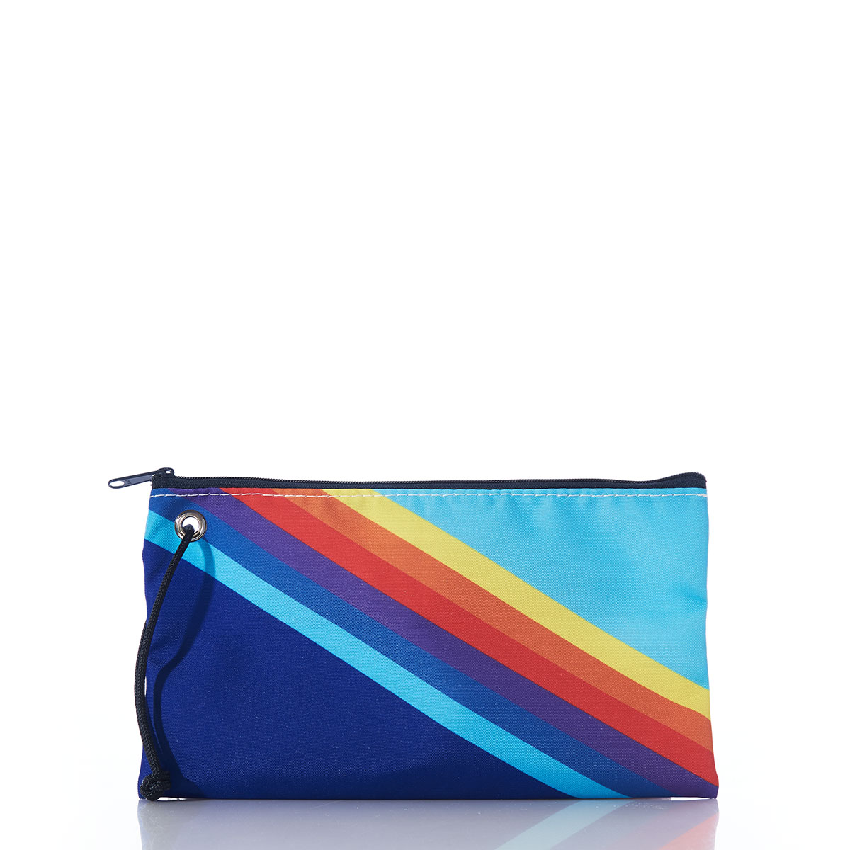 back view of a large wristlet is printed with retro stripes that range from light blue in the top left corner to dark blue in the bottom right corner, with rainbow colored stripes in between