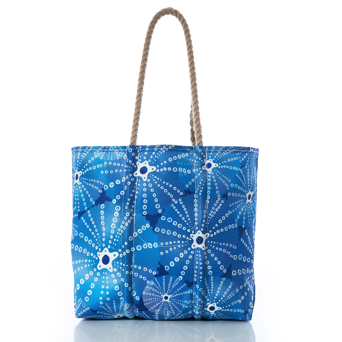 back view of blue sea urchins in an all over print on recycled sail cloth medium tote with hemp rope handles