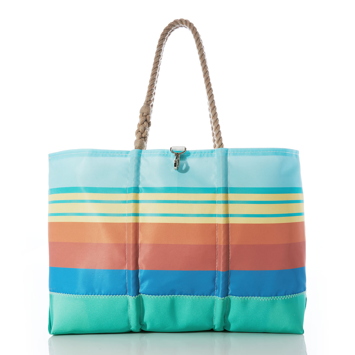 stripes in blue orange yellow and aquamarine printed on a recycled sail cloth beach tote with hemp rope handles