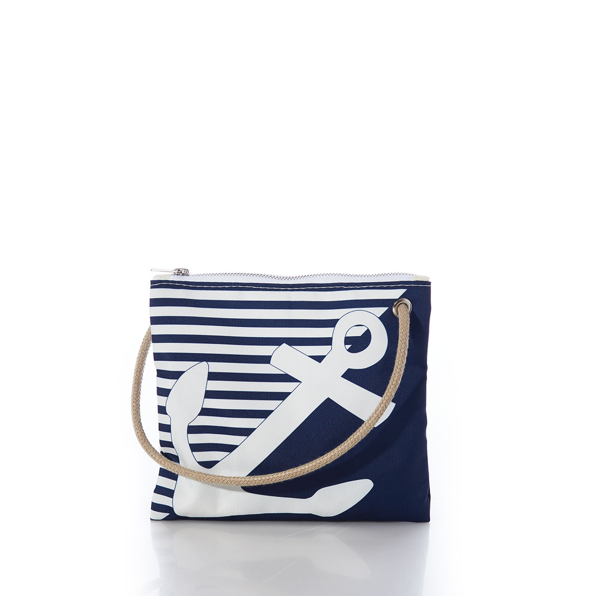 a white anchor divides a solid navy blue bottom right triangle and a navy and white striped top left triangle, printed on a recycled sail cloth crossbody bag with tan rope handle