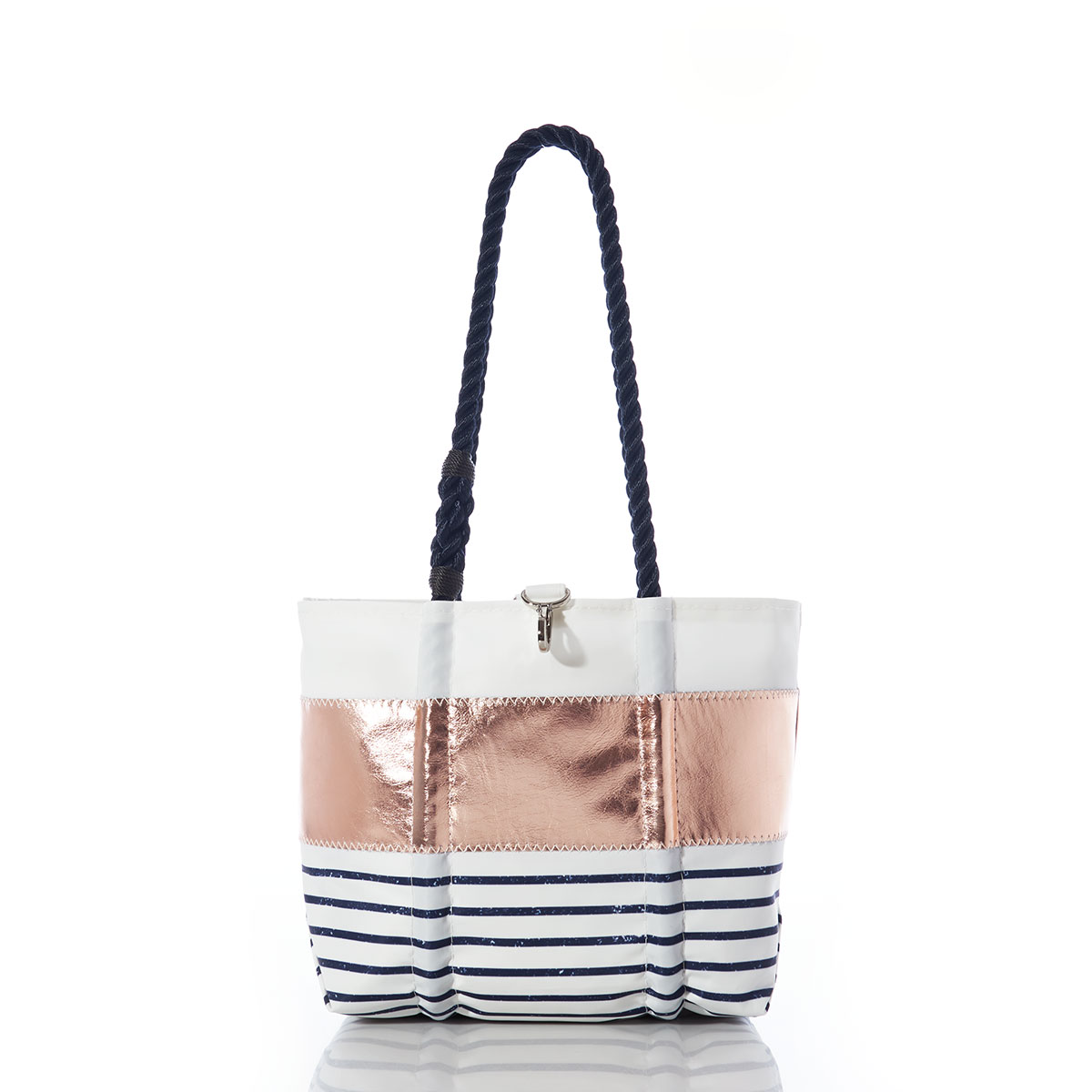 stripes of white, rose gold leather applique, and navy and white sailor stripes on a recycled sail cloth handbag with navy rope handles