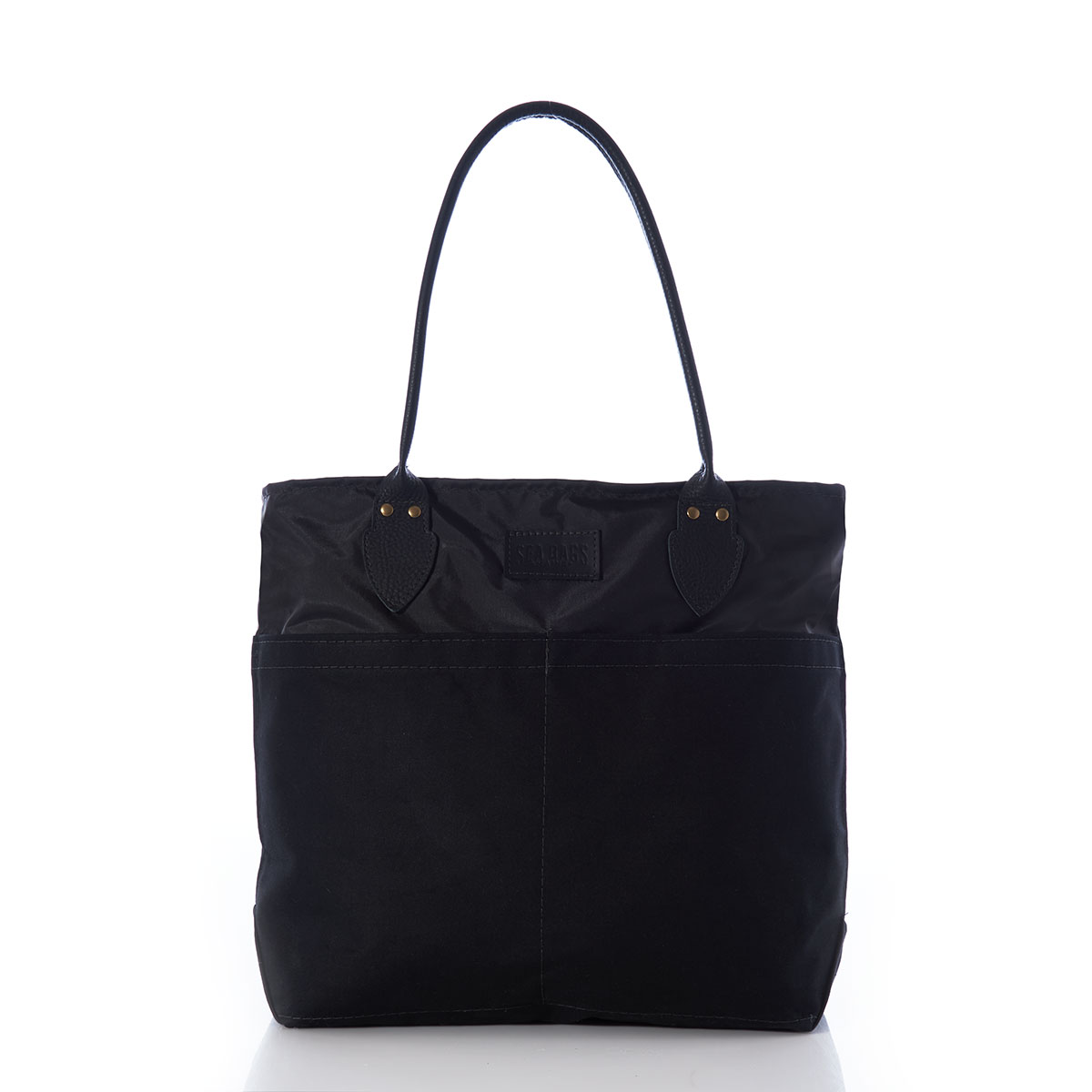 front view of a black recycled sail cloth medium tote with a black canvas bottom and leather handles