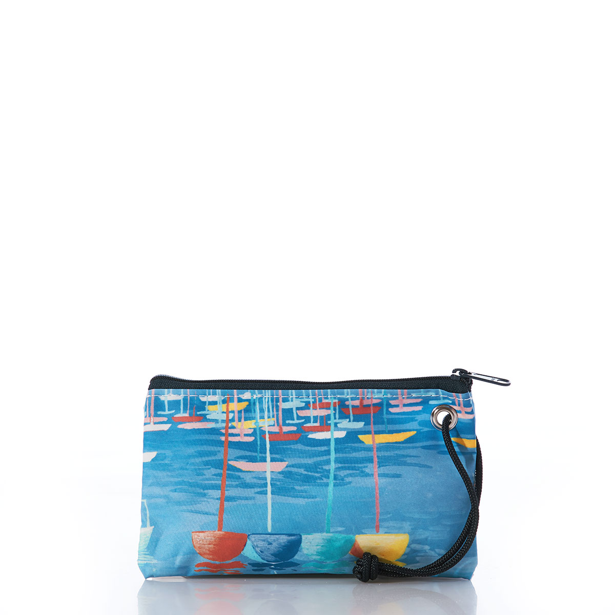 colorful sailboats bob in a blue ocean on a recycled sail cloth wristlet with a navy zipper
