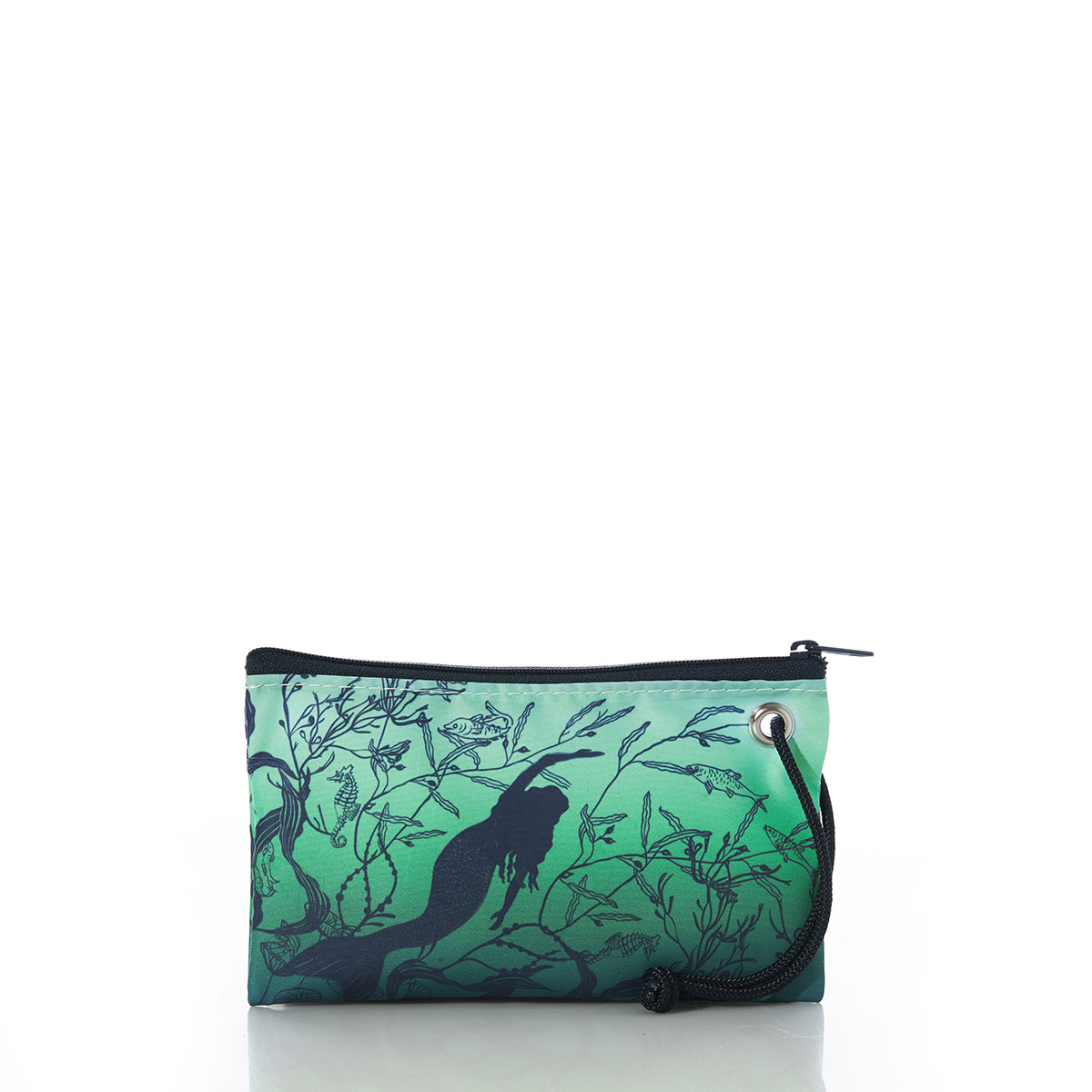 a navy silhouette of a mermaid swims in a sea of green and blue towards diagonally on a recycled sail cloth wristlet with navy zipper and wristlet strap
