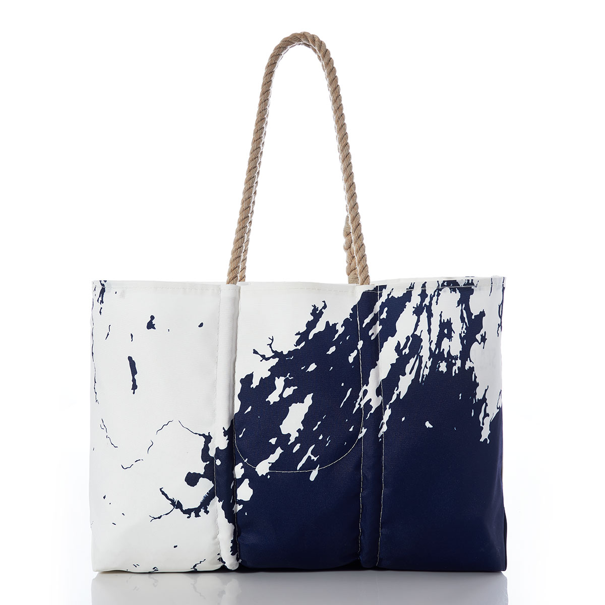back view of a recycled sail cloth tote with hemp handles is printed with a navy ocean next to a white coastline of Casco Bay 