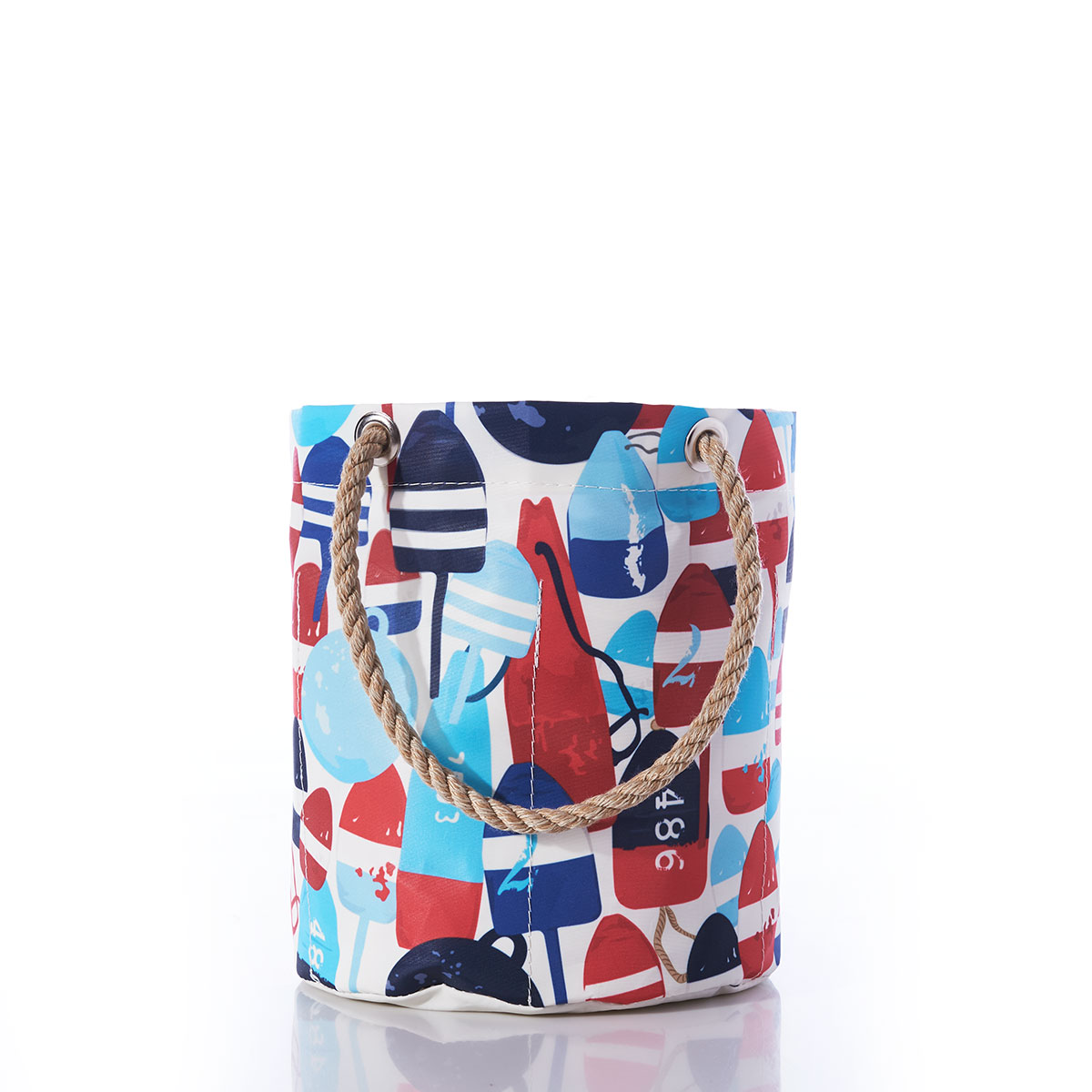 a recycled sail cloth beverage bucket bag with hemp rope handles is emblazoned with a variety of printed buoys in reds and blues in different shapes and sizes