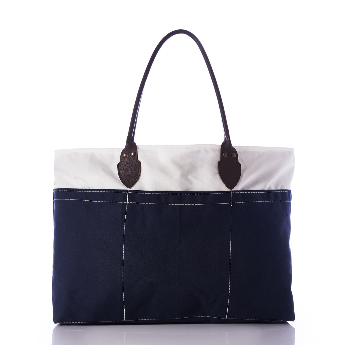 back view of recycled sail cloth and navy canvas tote with rolled brown leather handles