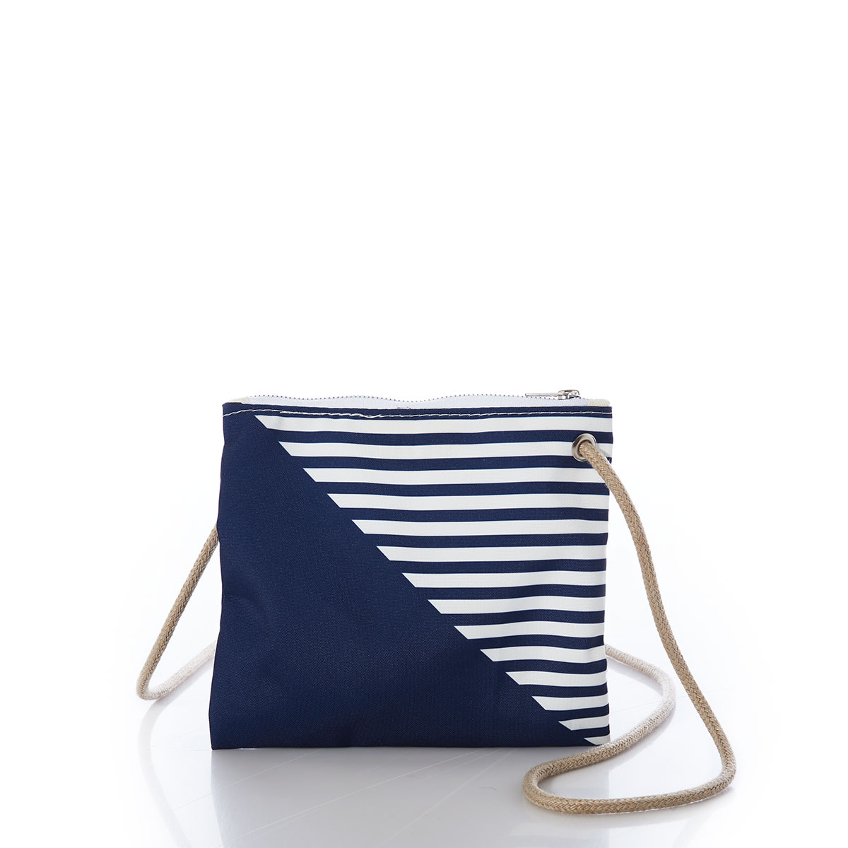 back view of a solid navy blue bottom right triangle and a navy and white striped top left triangle, printed on a recycled sail cloth crossbody bag with tan rope handle
