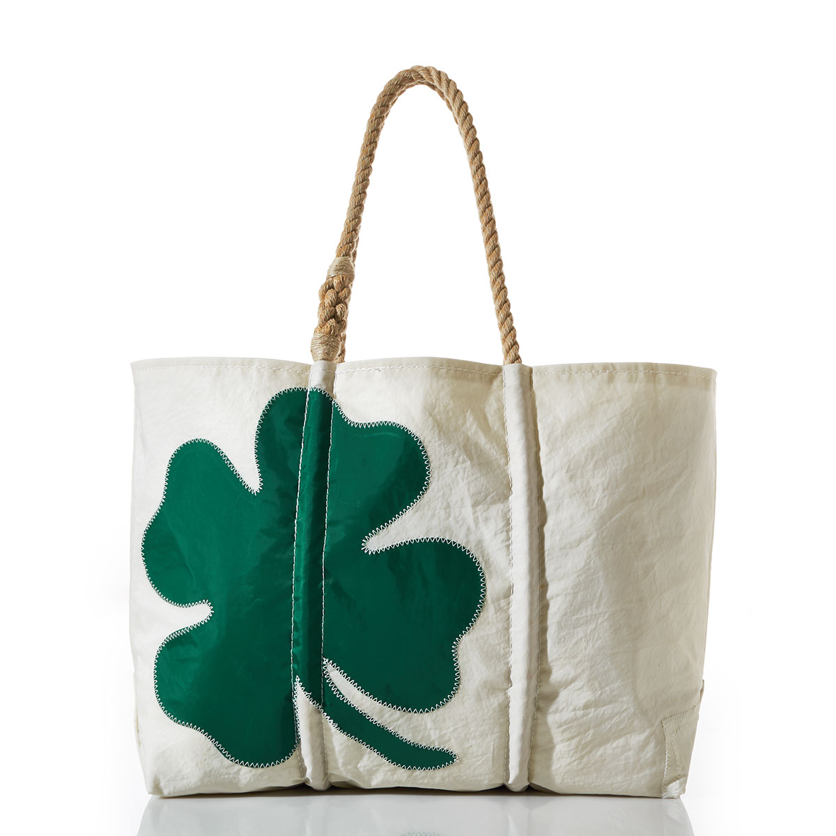green four leaf clover applique on a white recycled sail cloth tote with hemp rope handles