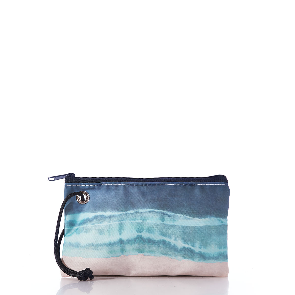 a recycled sail cloth wristlet is printed in naturally formed stripes with a bottom tan, middle light blue, and top dark blue 
