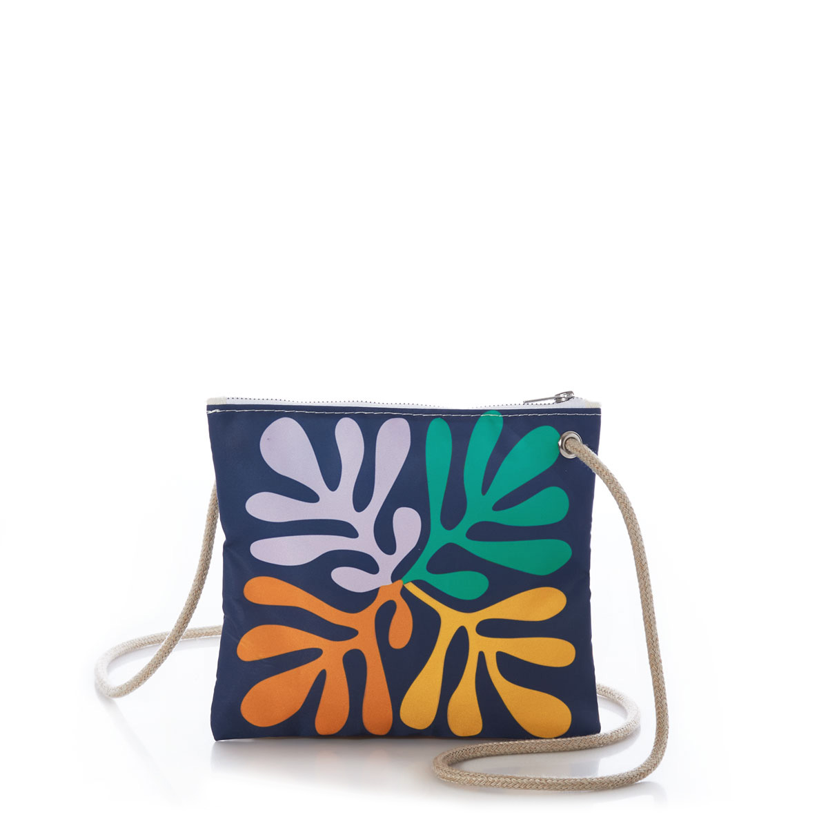 a navy sail cloth crossbody bag with long hemp rope handle is printed with a pattern of four blocks of four different colors of a strand of seaweed floral design