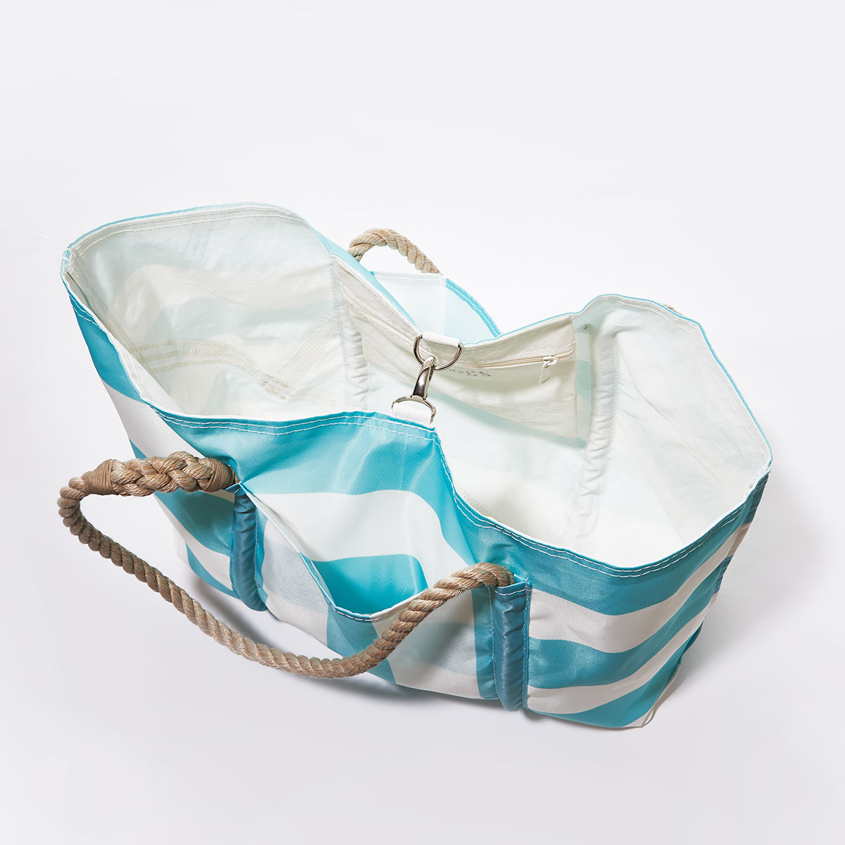 clasp closure: aquamarine and white plaid stripes adorn the front of a recycled sail cloth tote with hemp rope handles and a top metal clasp