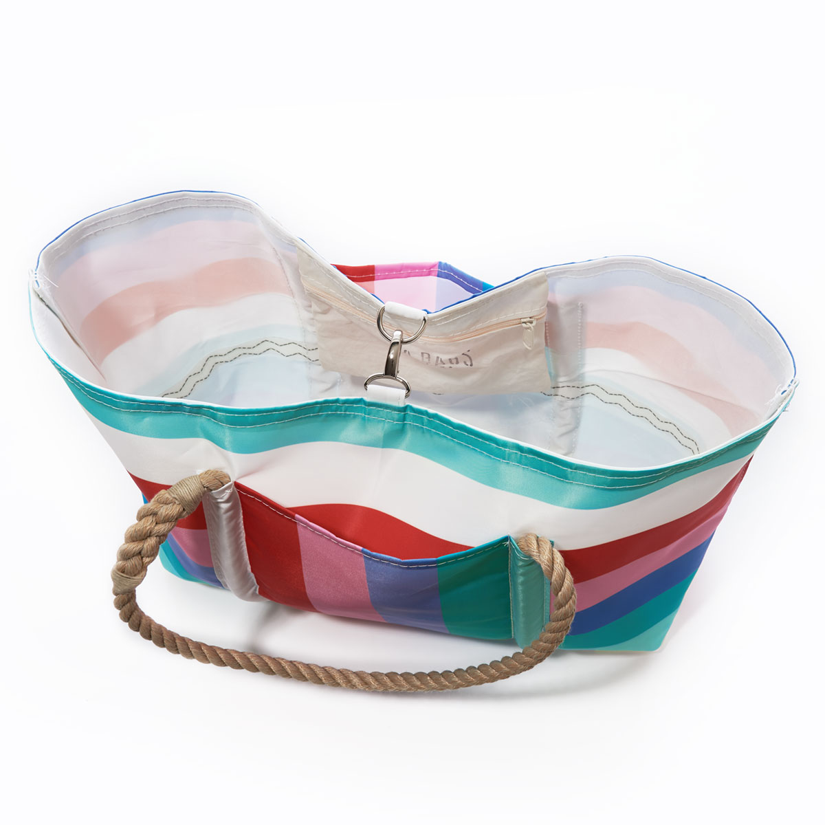top view showing clasp closure and interior zipper pocket of a recycled sail cloth pier tote with hemp rope handles and clasp closure is printed with bold stripes in shades of pinks and teals