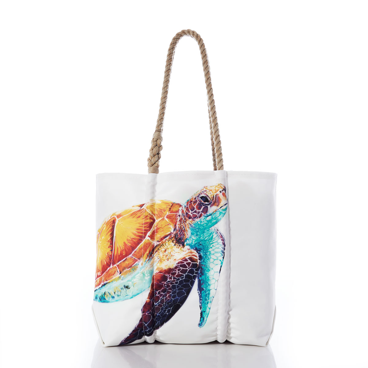 a bright friendly multicolor sea turtle is printed on a white recycled sail cloth tote with hemp rope handles
