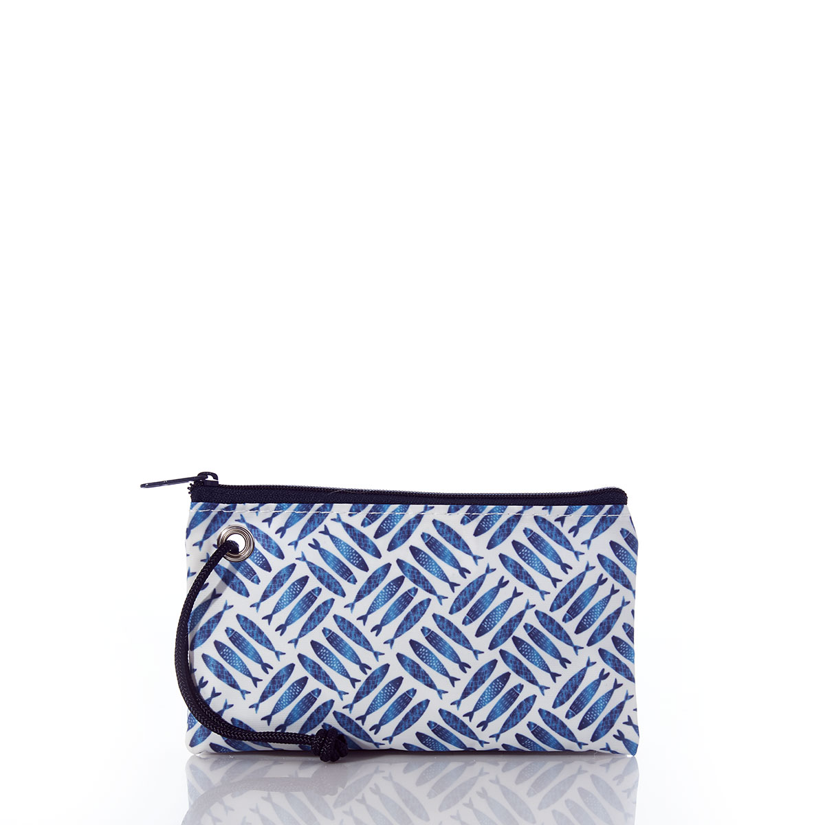 back view of criss cross print of blue school of fish on recycled sail cloth wristlet with navy zipper and wristlet strap