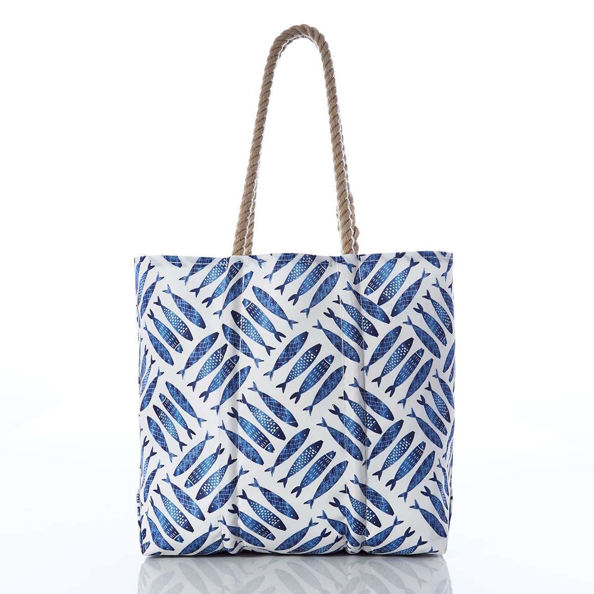 back view of criss cross print of blue school of fish on recycled sail cloth medium tote with hemp rope handles