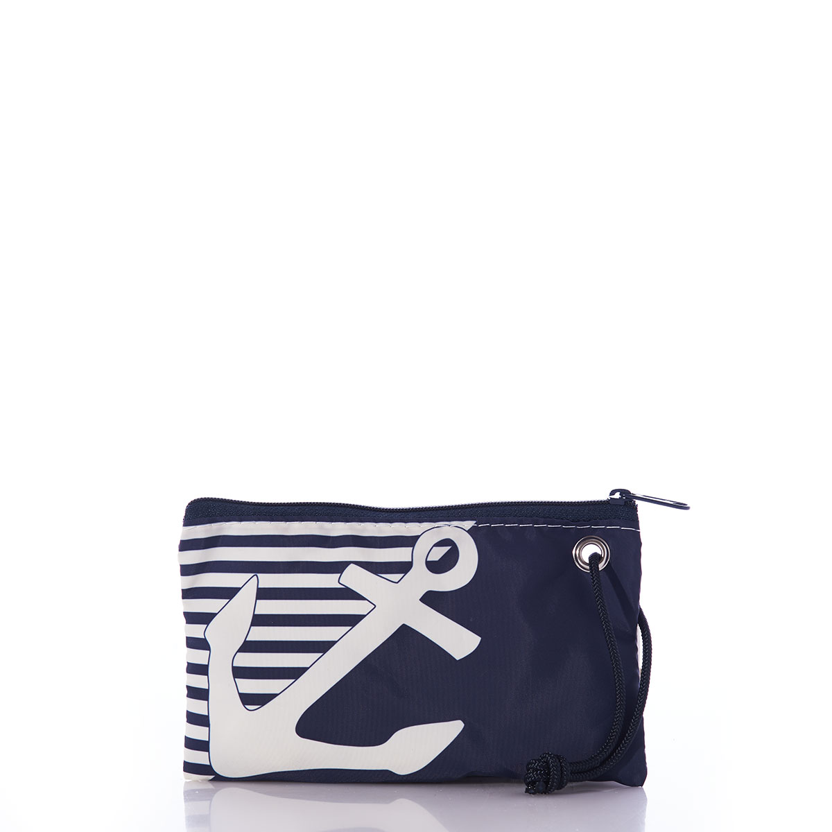 the breton stripe white anchor wristlet is embellished with a white anchor in front of a solid navy bottom corner and a navy and white striped top corner and a navy rope handles