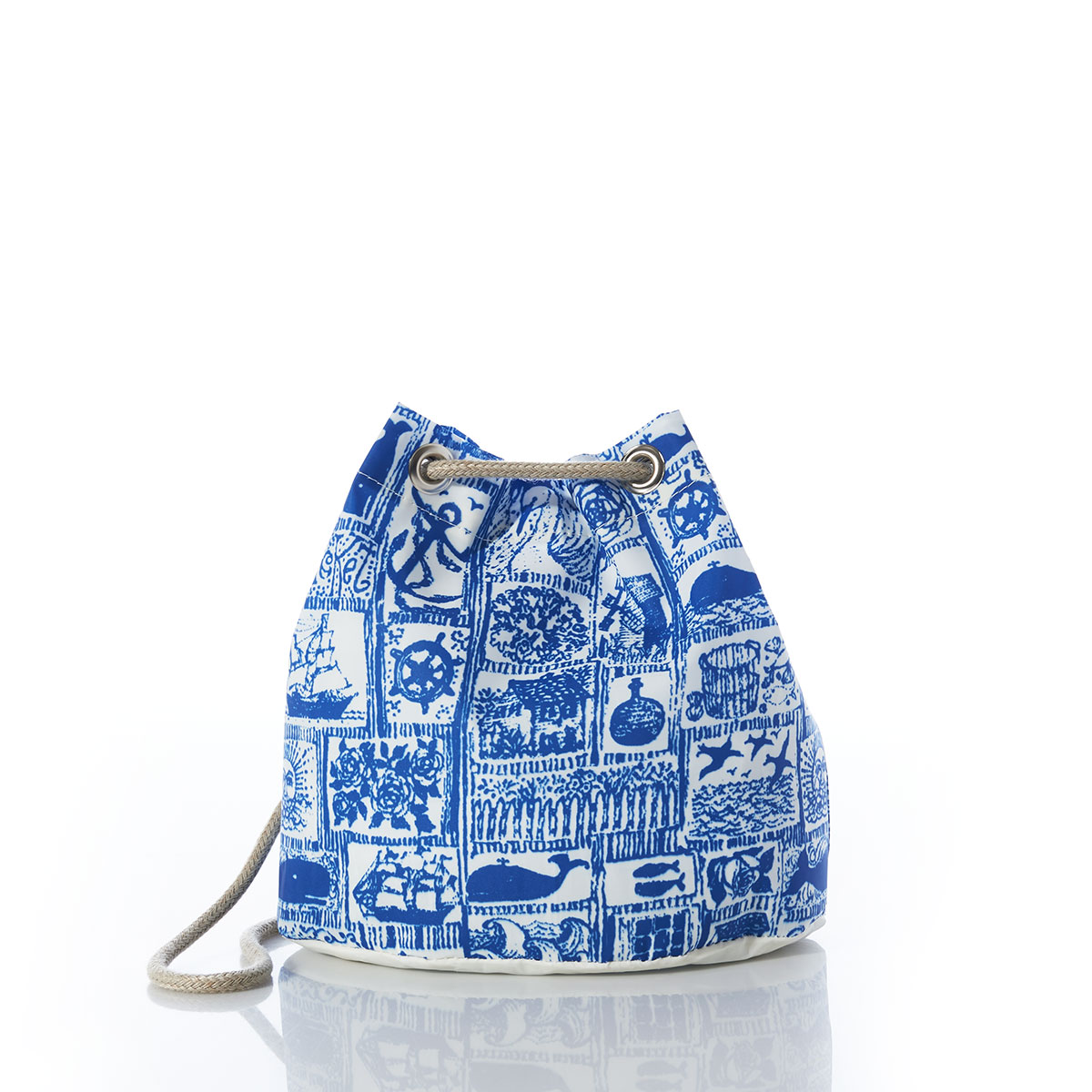 blue squares filled with various nautical imagery printed on recycled sail cloth convertible bucket bag with hemp dock line straps