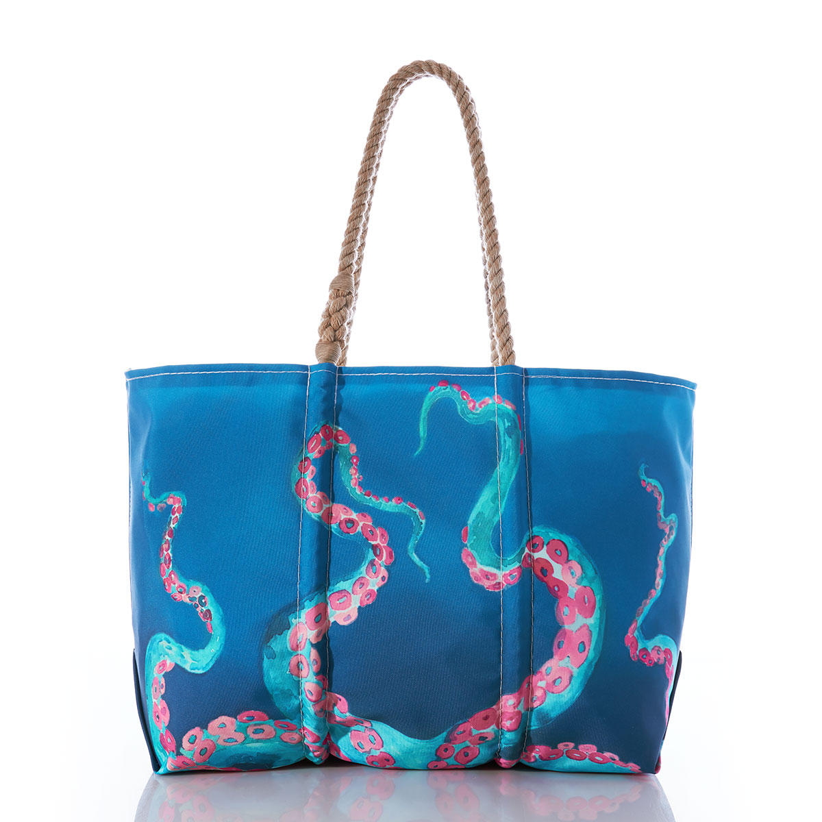 a colorful bioluminescent octopus in blue with pink tentacles stretches its legs up the the top of a blue recycled sail cloth tote with hemp handles