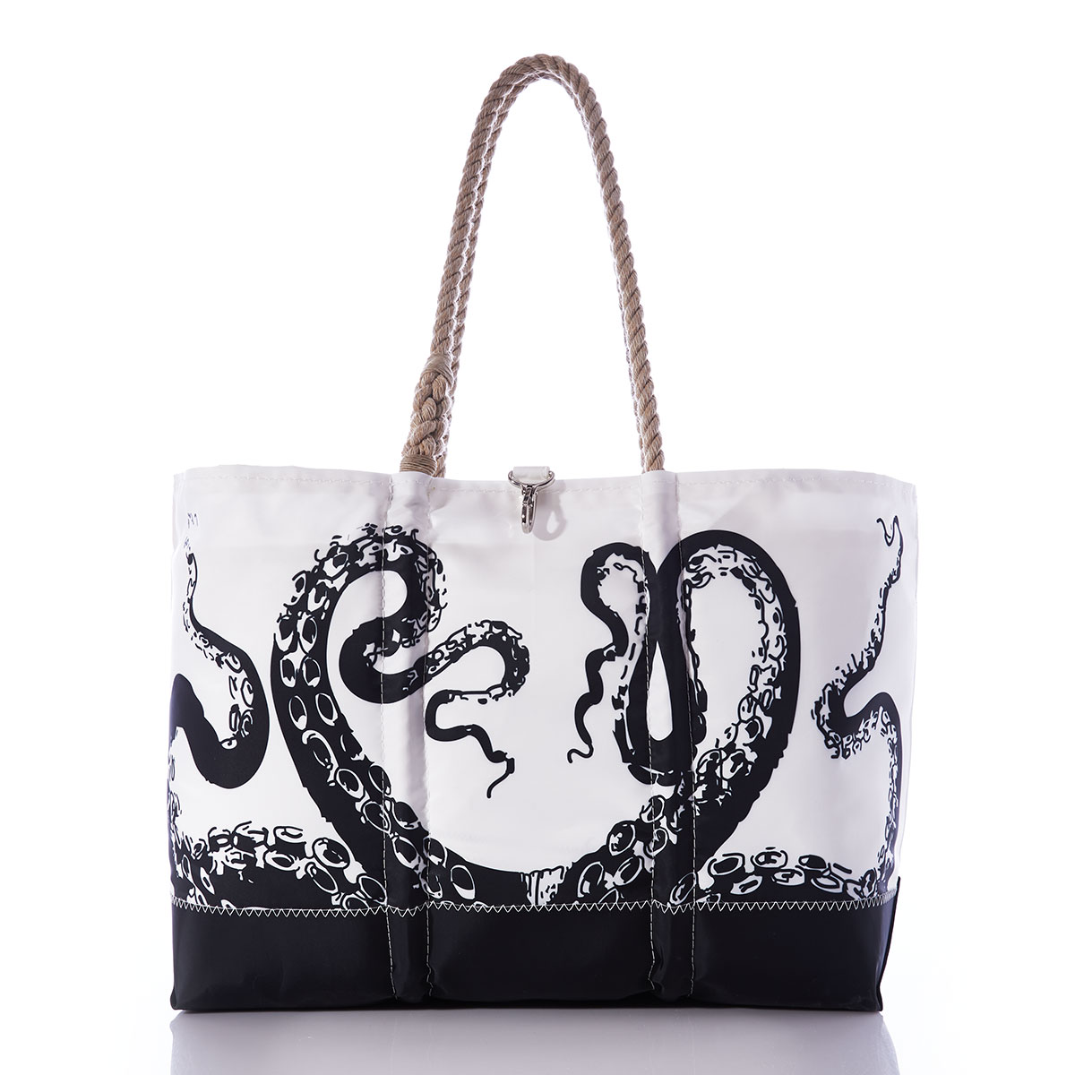 black legs of an octopus reach up to the top of this recycled sail cloth tote, with a solid black along the bottom, and hemp rope handles