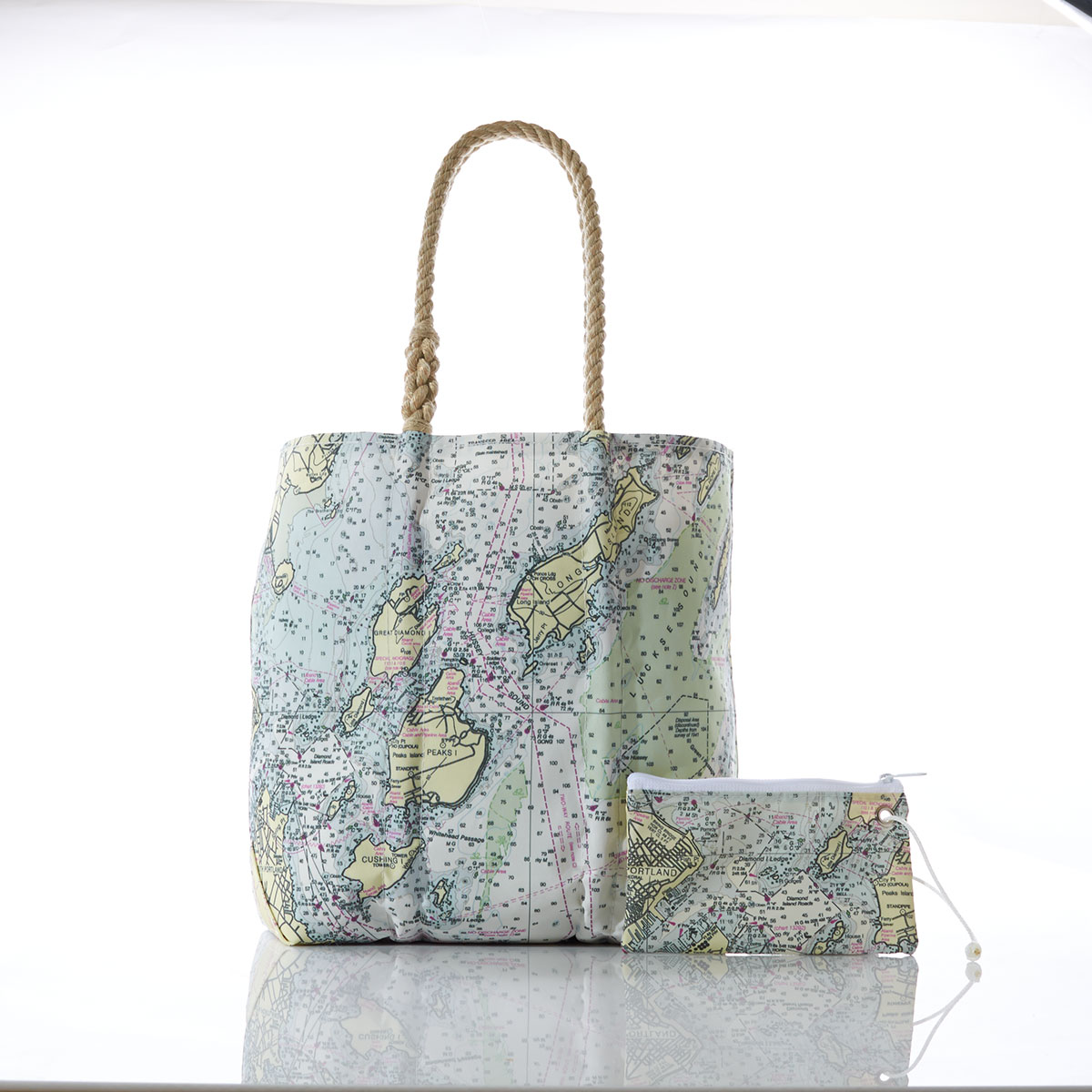 printed nautical chart of casco bay on recycled sail cloth tote with hemp rope handles, shown with matching wristlet