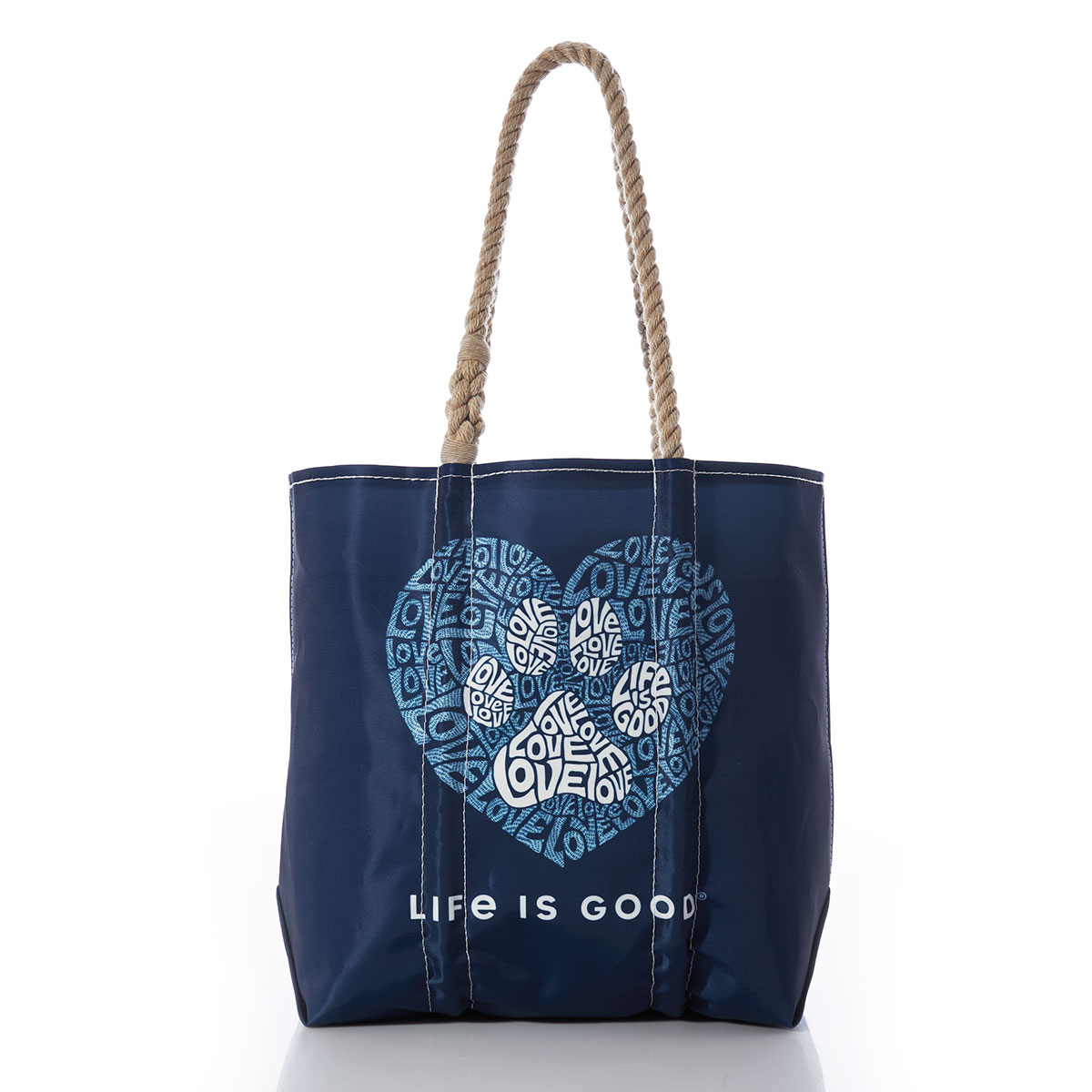 white paw print made of words inside light blue heart print made of words on navy recycled sail cloth medium tote with hemp rope handles