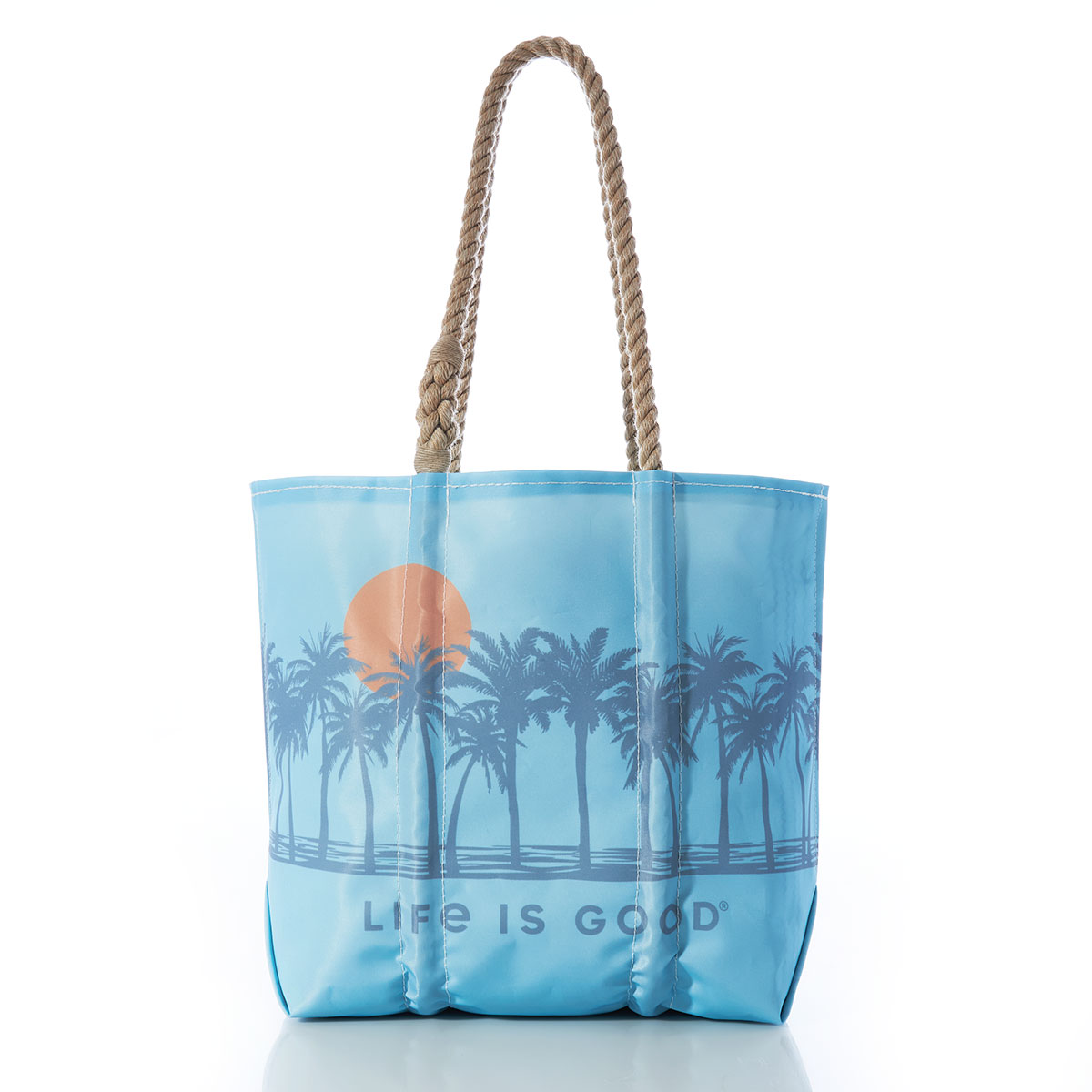a row of palm trees in front of a rising sun printed on a blue recycled sail cloth medium tote with hemp rope handles