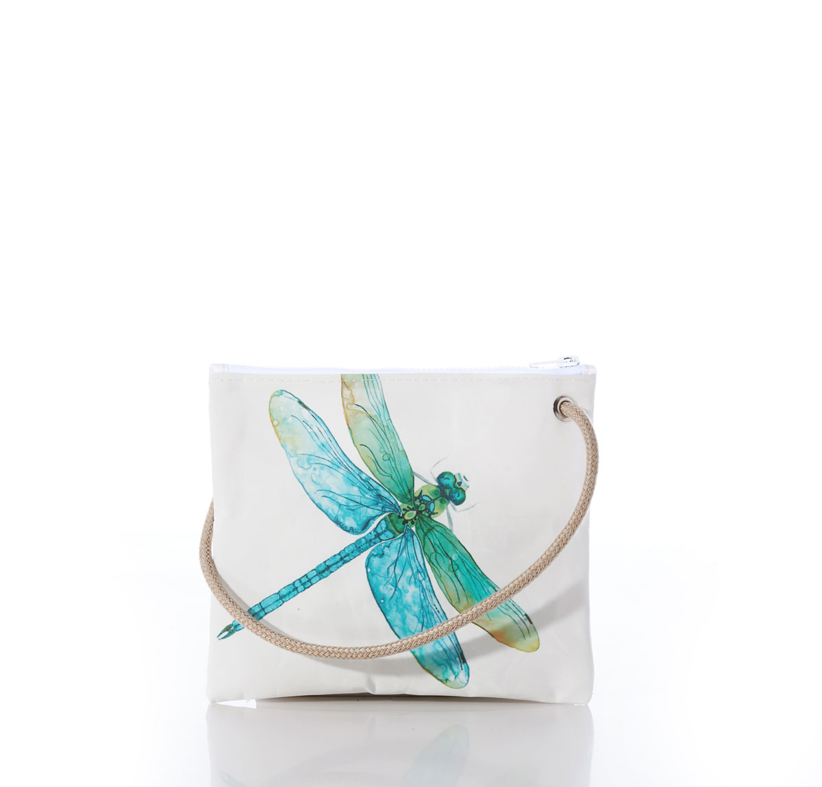 a dragonfly in light shades of blues and greens flies across a white recycled sail cloth crossbody bag with a tan braided dock line rope handle