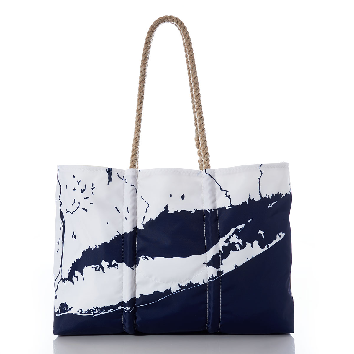 back view of a recycled sail cloth tote with hemp handles is printed with a navy ocean next to a white coastline of Long Island