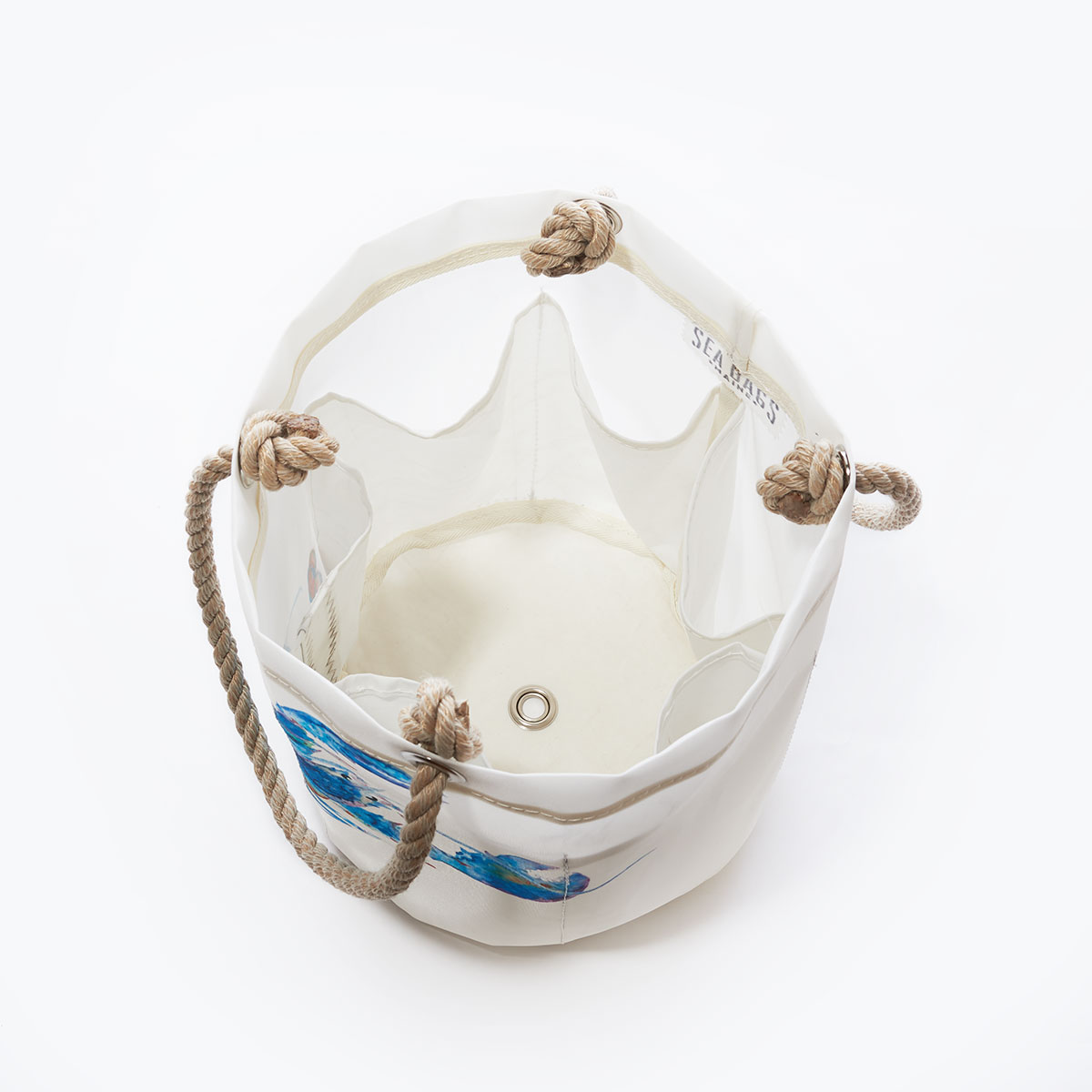 inside view showing six bottle pockets of a white recycled sail cloth beverage bucket with hemp rope handles and printed with a watercolor lobster in shades of blue