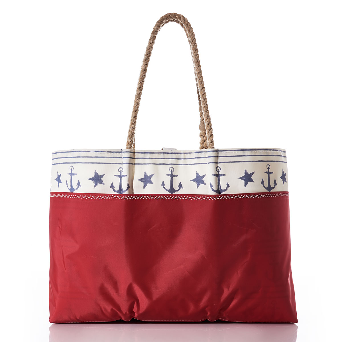 back view showing red outer pocket, blue anchors stars and stripes line this recycled sail cloth tote with a red bottom and hemp rope handles