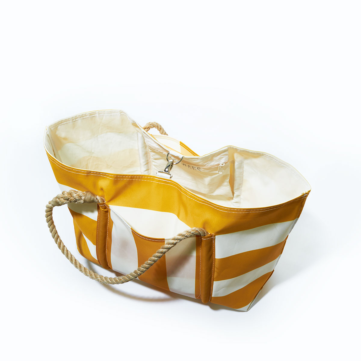 closed clasp: yellow and white plaid stripes adorn the front of a recycled sail cloth tote with hemp rope handles and a top metal clasp