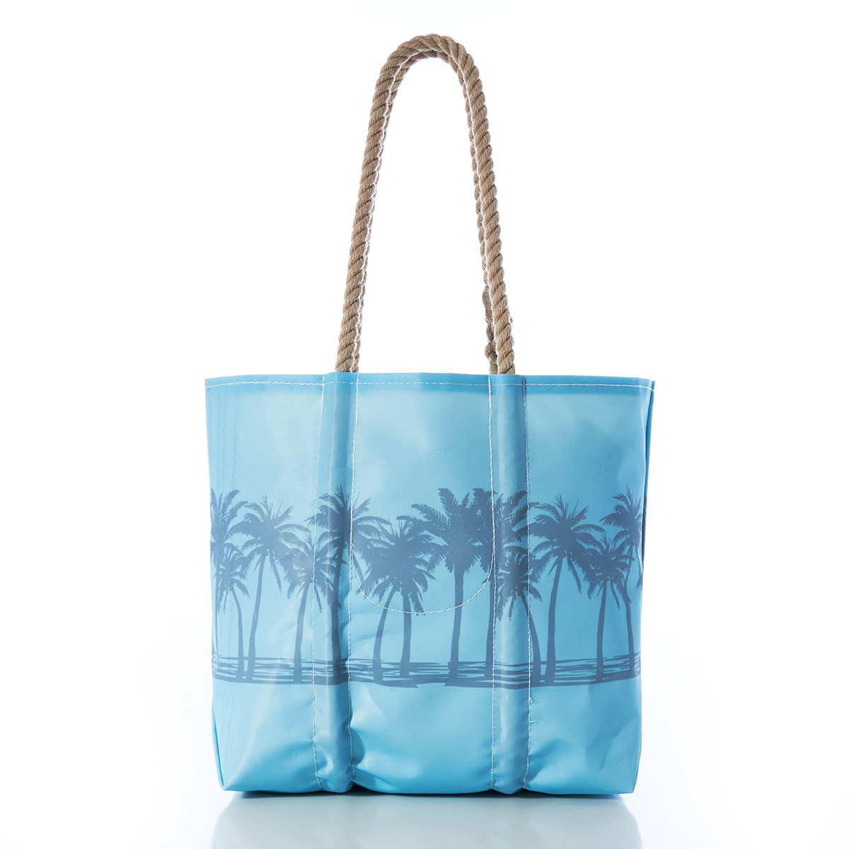 back view of a row of palm trees in front of a rising sun printed on a blue recycled sail cloth medium tote with hemp rope handles
