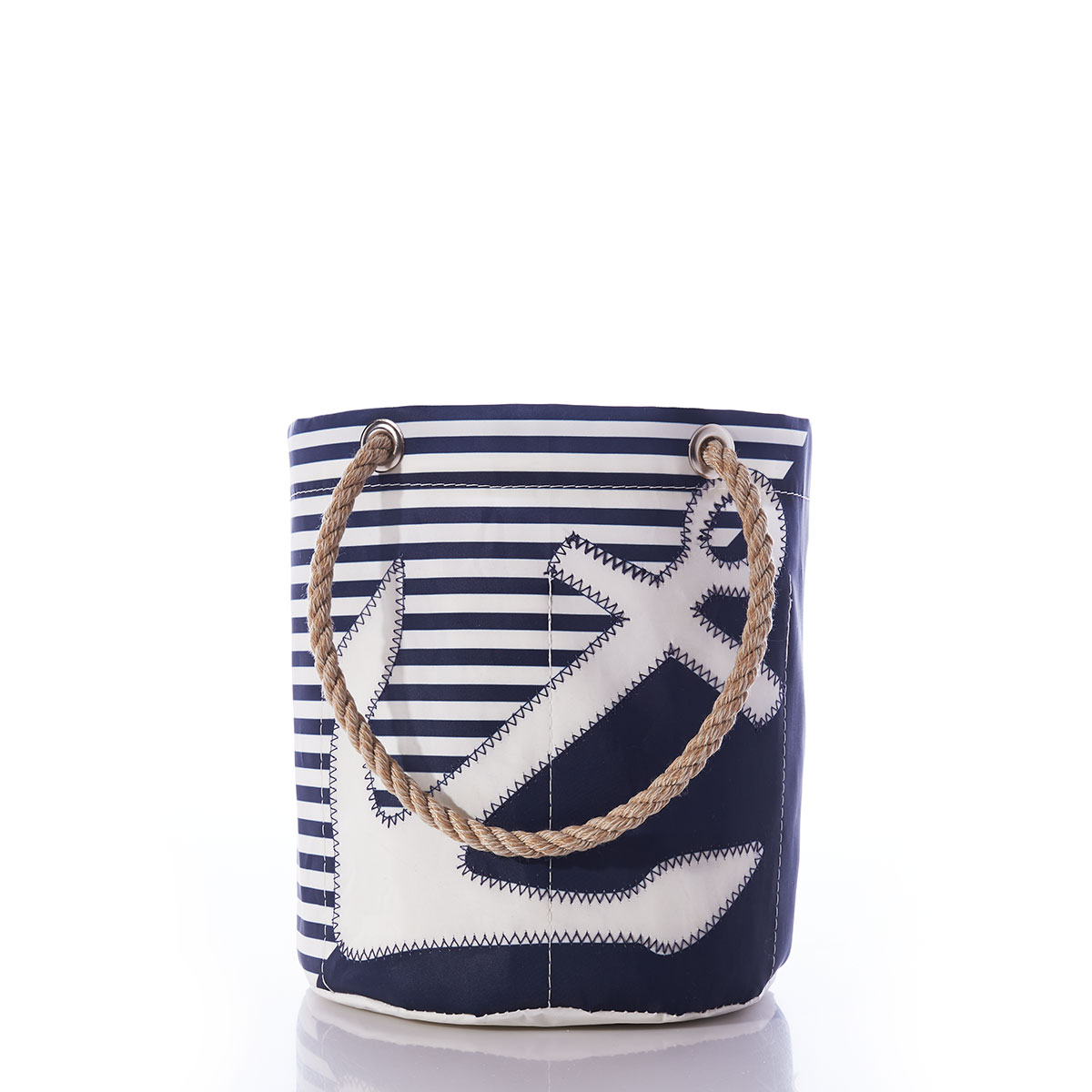 the breton stripe white anchor beverage bucket is embellished with a white anchor in front of a solid navy bottom corner and a navy and white striped top corner and navy rope handles