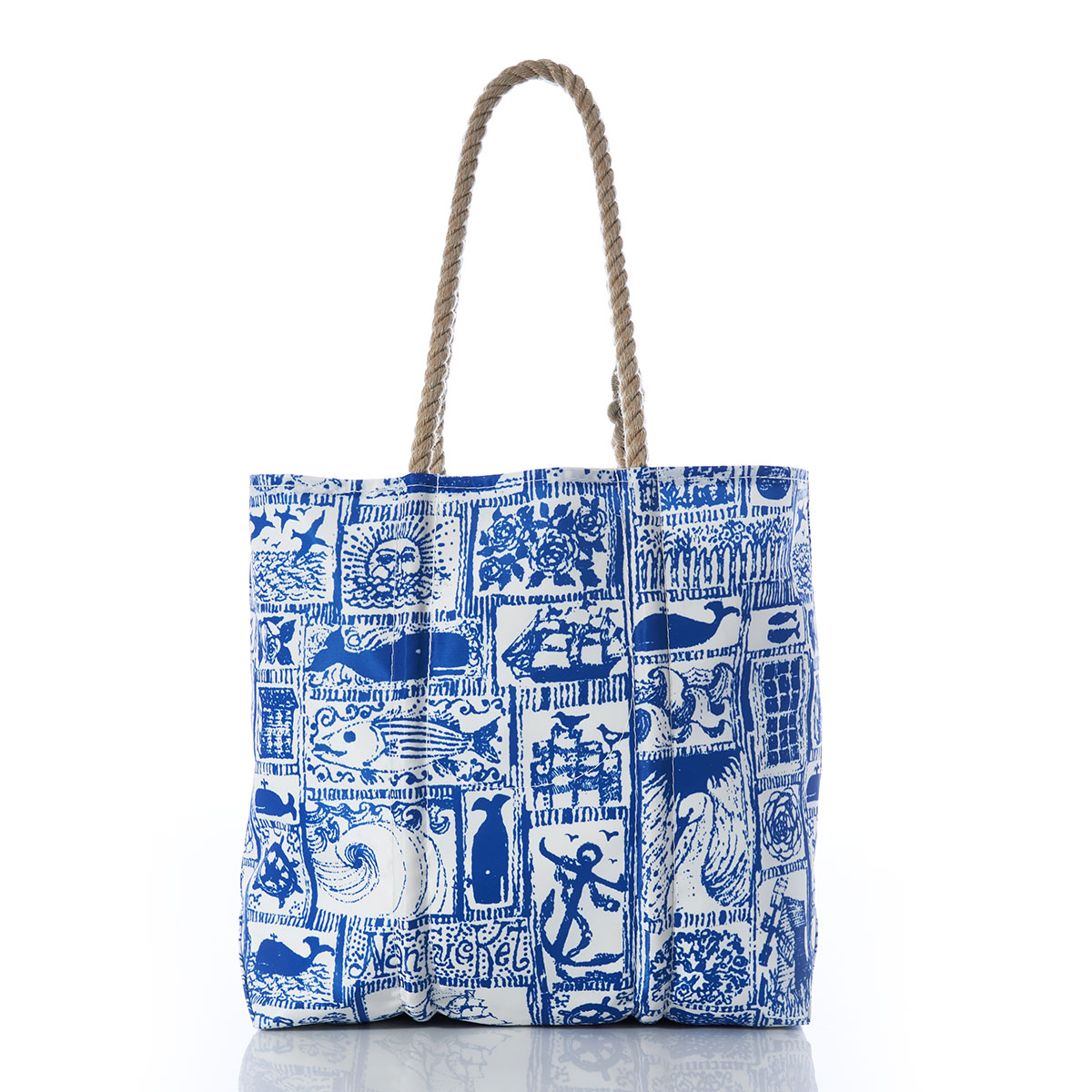 back view of blue squares filled with various nautical imagery printed on recycled sail cloth medium tote with hemp rope handles