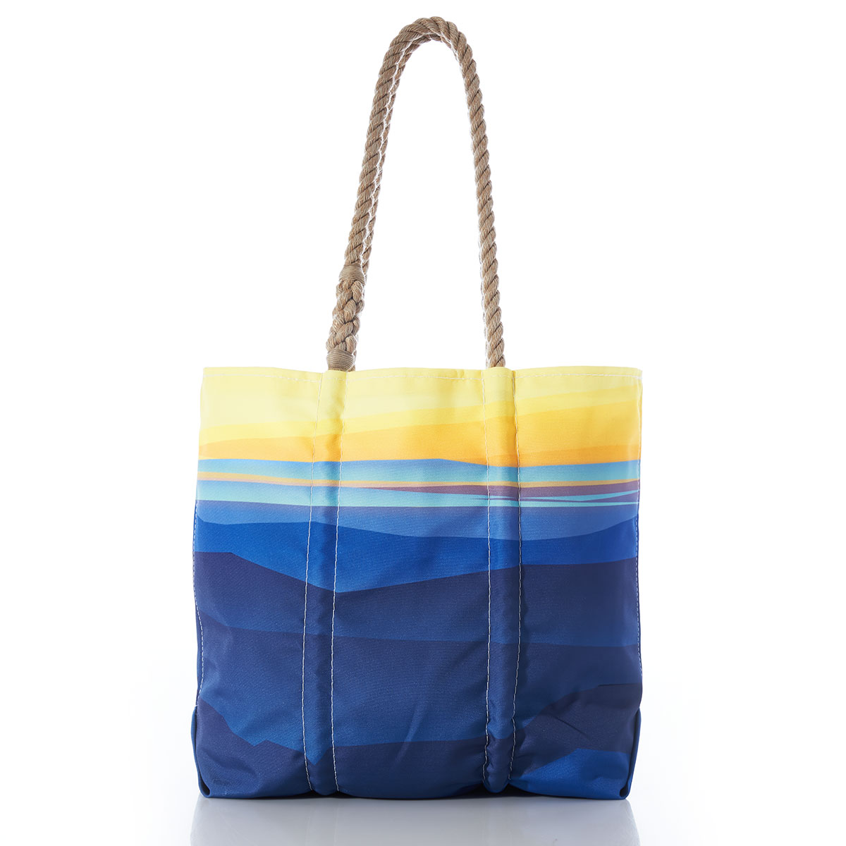 recycled sail cloth medium tote with hemp rope handles printed with a landscape of a yellow sunrise over blue mountains and water