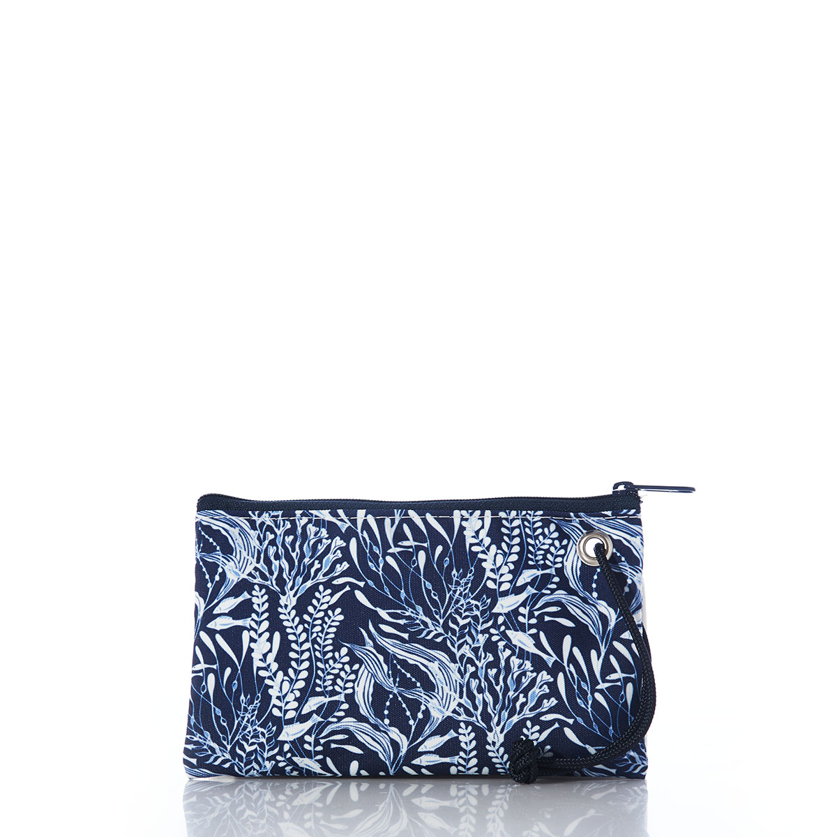 little fish swim among various types of seaweed in shades of navy and white on a recycled sail cloth wristlet