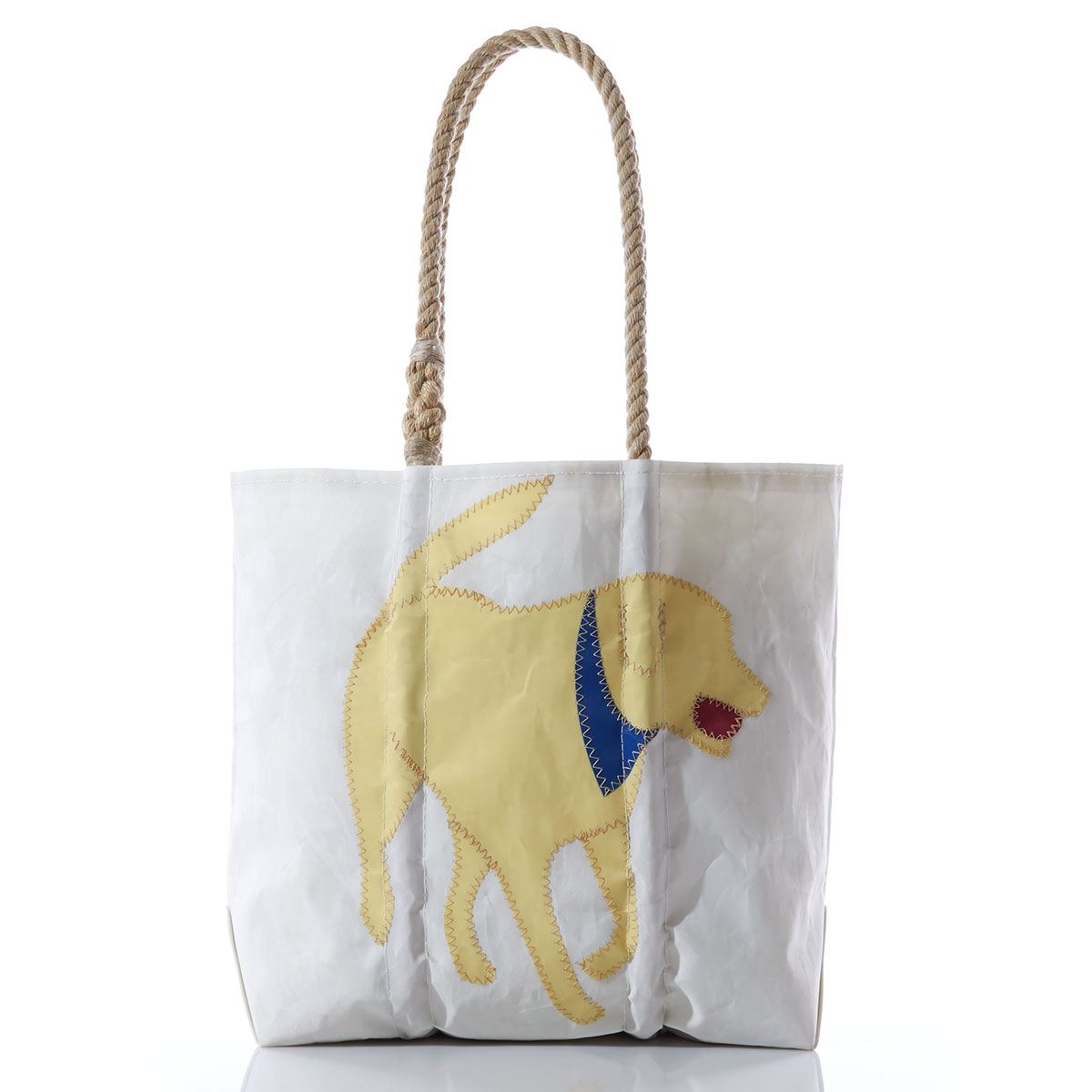 yellow lab applique with a blue bandana and red ball in his mouth on the front of a recycled sail cloth tote with hemp rope handles
